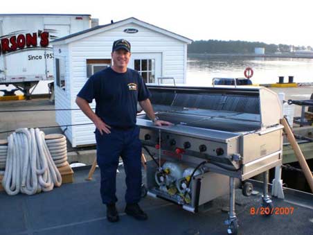 The US Coast Guard proudly accepts ownership of their new MagiCater Commercial Outdoor Grill 